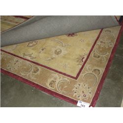 APPROX 9'X6' WOOL PILE AREA RUG - EARTH TONES WITH BURGANDY BORDER