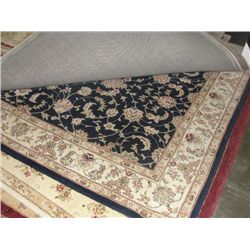 APPROX 8'X6' WOOL PILE AREA RUG - EARTH TONES FLORAL WITH BLUE BORDER