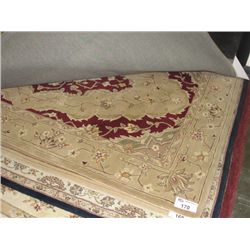 APPROX 8'X5' WOOL PILE AREA RUG - EARTH TONES FLORAL PATTERN