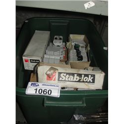 GREEN RUBBERMAID CONTAINER FILLED WITH RESIDENTIAL CIRCUIT BREAKER SWITCHES