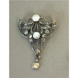 A Brooch...