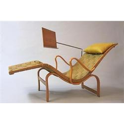 An Easy chair with a reading table...
