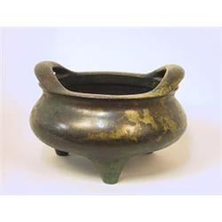 A Bronze tripod...