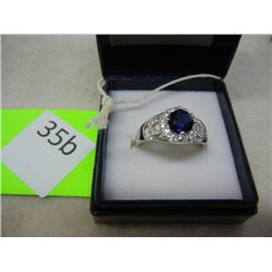 Sterling Silver Ring, size 7.75 w/ 1.5ct Sapphire Center Stone and White Sapphire Framing Stones
