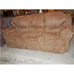 Reclining Brown Microfiber Sofa Reclines on both ends. One Year Old