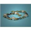 Image 1 : Gold bracelet, with cultured pearls and blue enamel, 18 Kt, l. 16,5 cm. …