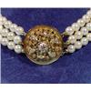 Image 2 : Three strands of cultured pearls with gold filigree clasp, 18 Kt, l. 40 cm.…