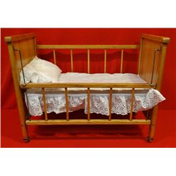 Handmade oak & oak veneer doll bed; 24"l x 19"high x 14" wide, w/mattress & pillow