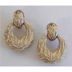 ATTRACTIVE PAIR OF FOURTEEN KARAT YELLOW GOLD EAR CLIPS Each cast with a "leaf" motif. $300/500...