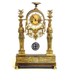 FINE EMPIRE GILT BRONZE MANTEL CLOCK French. Late 18th Century. The drum form case surmounted by...