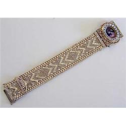 FOURTEEN KARAT YELLOW GOLD BRACELET WATCH The detachable watch case with hinged cover, centered b...