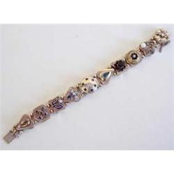 FOURTEEN KARAT YELLOW GOLD SLIDE BRACELET WATCH Centered by a circular watch case with spring loa...