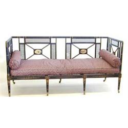 VERY FINE REGENCY EBONIZED AND CANED SETTEE English. Circa 1830. The sectional backrest with two...