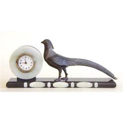 ART DECO MARBLE, ONYX AND PATINATED METAL CLOCK German. Circa 1925. The circular dial with Arabic...