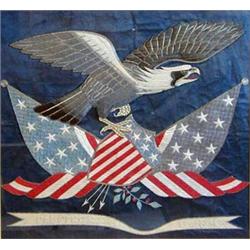 SILK EMBROIDERY OF THE AMERICAN SEAL The eagle facing left holding two American flags and a shiel...