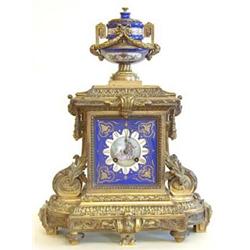 EMPIRE STYLE SEVRE PORCELAIN AND GILT BRONZE MANTEL CLOCK French. 19th Century. The rectangular p...