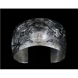 Northwest Coast Repousse Silver Sun Mask Bracelet with Hummingbird and Octopus Design by Graham Henr