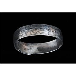 Tlingit Silver Bracelet with Incised Salmon and Wolf Design 9" L. 5/8" W.  Fine Condition