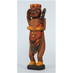 Fine Early 1900's Tlingit Carving Featuring a Strongman Splitting a Seal 9" H.  Good Condition