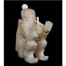 Marine Ivory Carving of Seated Inuk Holding Club and Smoking a Pipe  - Inuit Greenland Culture ca. 1