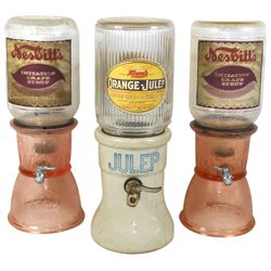 Syrup dispensers (3), 2 Nesbitt's, both w/pink textured glass bases & emb "Property of Nesbitt's-For