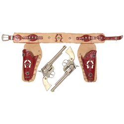 Toy cap guns & holsters, lg cowboy guns in holsters w/horseshoe, metal & blue gemstone embellishment