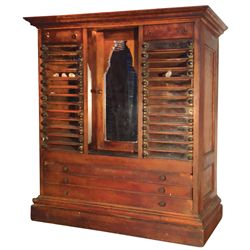 Spool cabinet, early walnut 32-drwr, 26 glass fronts & 6 wood, arched center mirror, Patent 1877 har