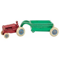 Toy, early Arcade cast iron farm tractor w/driver & trailer, orig balloon tires, original paint, Exc
