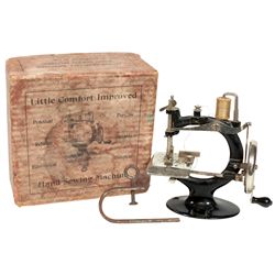 Child's sewing machine, Little Comfort Improved, cast iron, VG cond w/orig box, 7"H x 7.5"W.