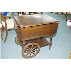 Drop leaf tea wagon with single drawer and slide out serving tray