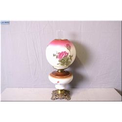 Antique banquet lamp with cast base and hand painted bowl and globe
