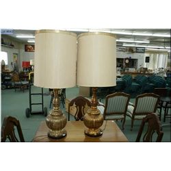 A matched pair of gold table lamps