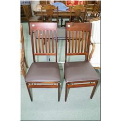 Two modern folding chairs and a tilting chair side tray with castors