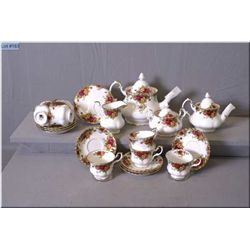 A Royal Albert "Old Country Roses" tea set including teapot, cream and lidded sugar, single serve te