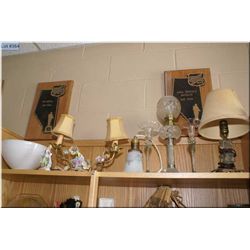 A selection of vintage collectibles including figural lamp, candle holders, oil lamp etc. plus a flo