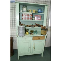 A primitive chest on chest open display cabinet