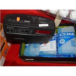 RADIO AND BOX OF ICE PACKS