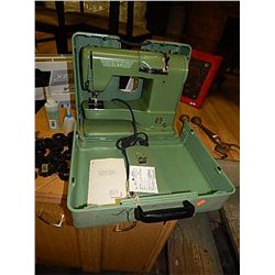 VINTAGE ELNA SEWING MACHINE - WITH ORIGINAL METAL TRAVEL CASE AND PAPERS