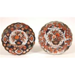 A 19th Century Japanese Imari Plate, of circular lobed form, decorated a vase of flowers, 21 cm,...