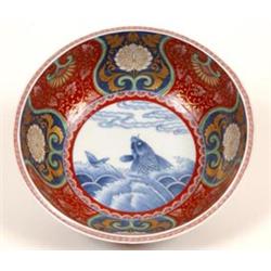 A Japanese Imari Bowl, decorated with flowers and a fish, 24.5 cm  See illustration £100-150...