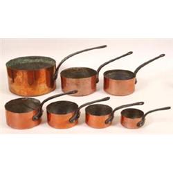 A Graduated Set of Seven 19th Century Copper Saucepans, with riveted loop handles  See illustrati...