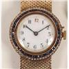 Image 1 : A 9ct Gold Wristwatch, set sapphires and seed pearls, on a 9ct gold bracelet,  See illustration £...
