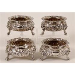 A Set of Four George IV Silver Salts, with foliate cast flower edging and chased foliage, on thre...