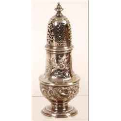 A George III Silver Caster, crested, decorated scrolling foliage, London 1779, 16 cm  See illustr...