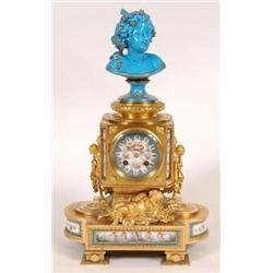 A 19th Century French Ormolu Clock, the 8 cm diameter dial painted a cherub, the case with a turq...