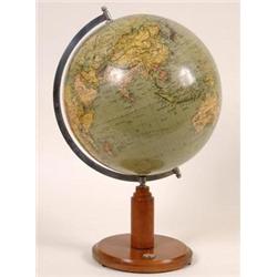 A 20th Century Terrestrial Globe, on a beech stand inset a compass  See illustration £140-160...