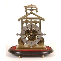 A Victorian Brass Skeleton Clock, with a silvered chapter ring having stylised fleur de lys motif...