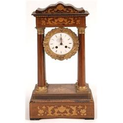 A 19th Century French Portico Clock, in an inlaid rosewood case, 50 cm  See illustration £70-100...