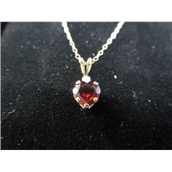 Ladies Garnet & CZ pendant in 10K yellow gold