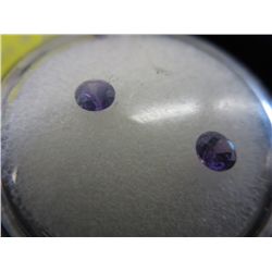 2 round cut matched stones. Roughly 3 mm dia.